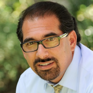 Colored headshot of Dr. Ziyad (Zee) H. Duron wearing a white button up shirt and yellow tie